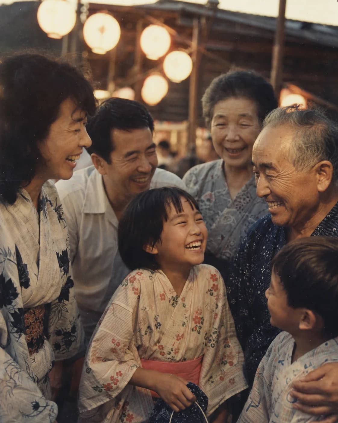 A family laughing together at a summer festival